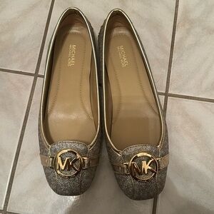 A pale gold Michael Kors Fulton MOC flats in size 7.5 M